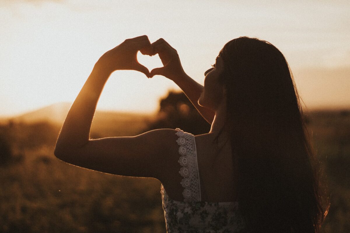 Woman making a heart shape with her hands