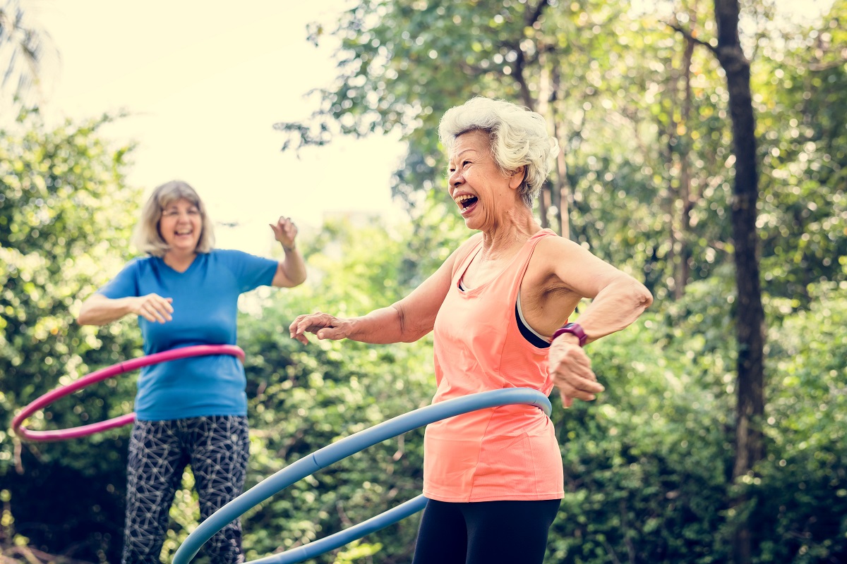 Two women laughing outside