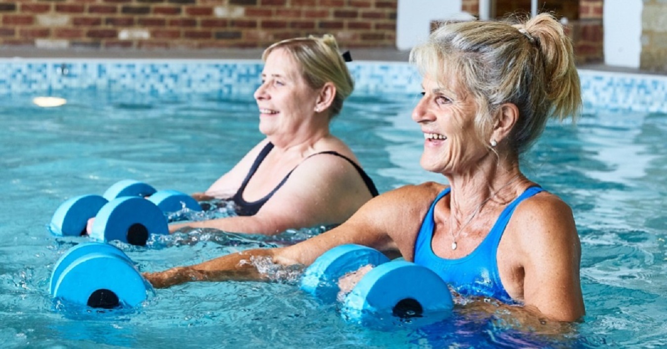 Two women exercising in the pool