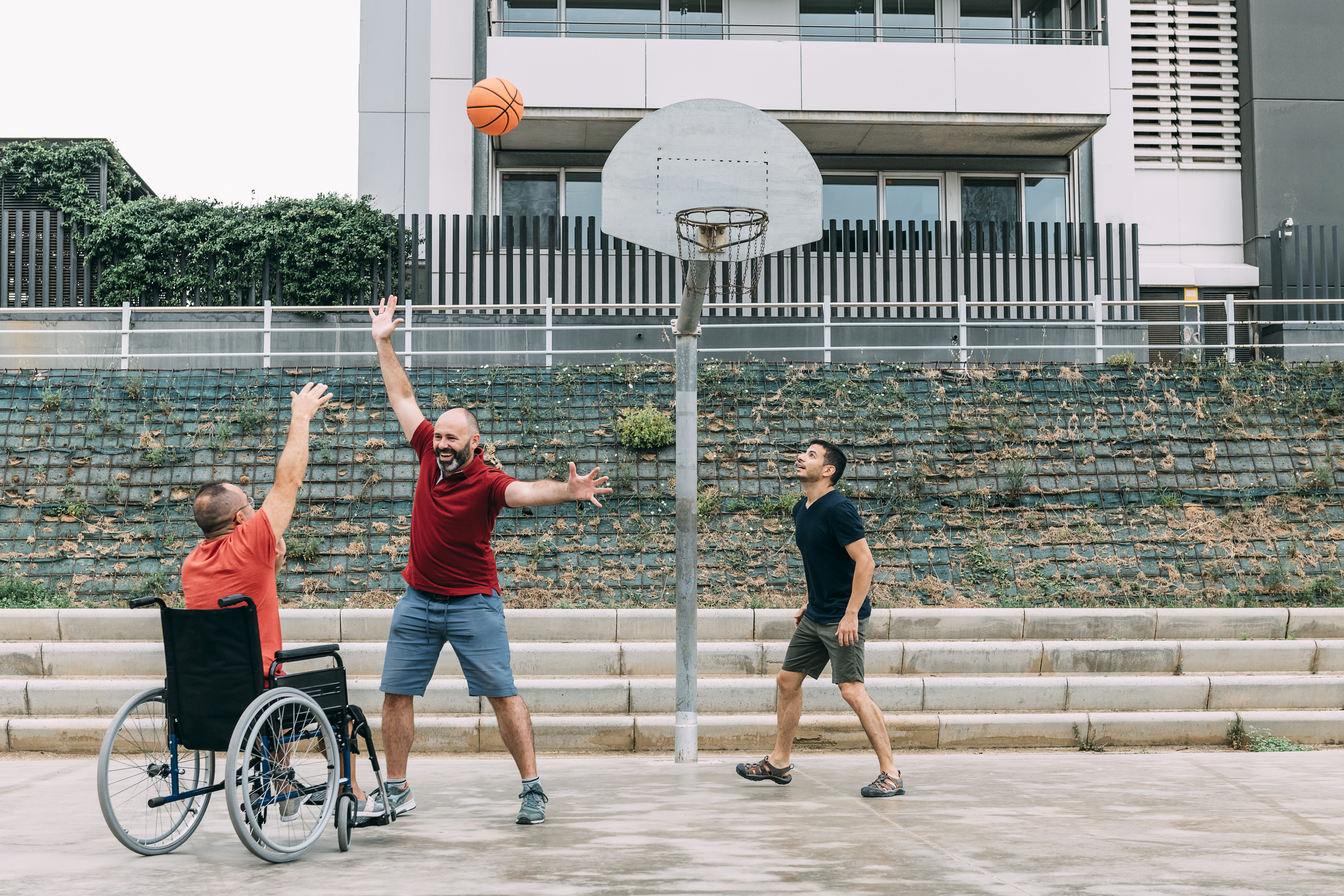 Men playing basketball